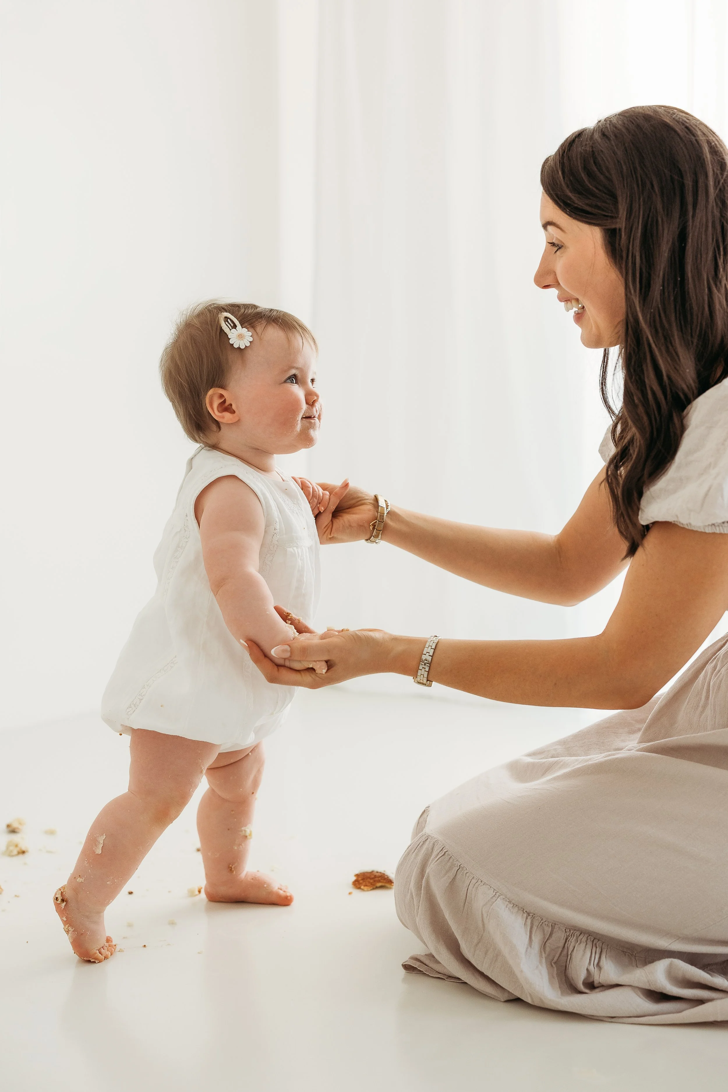 A mother and daughter celebrating a special milestone together, capturing the joy, connection and messy moments of childhood.