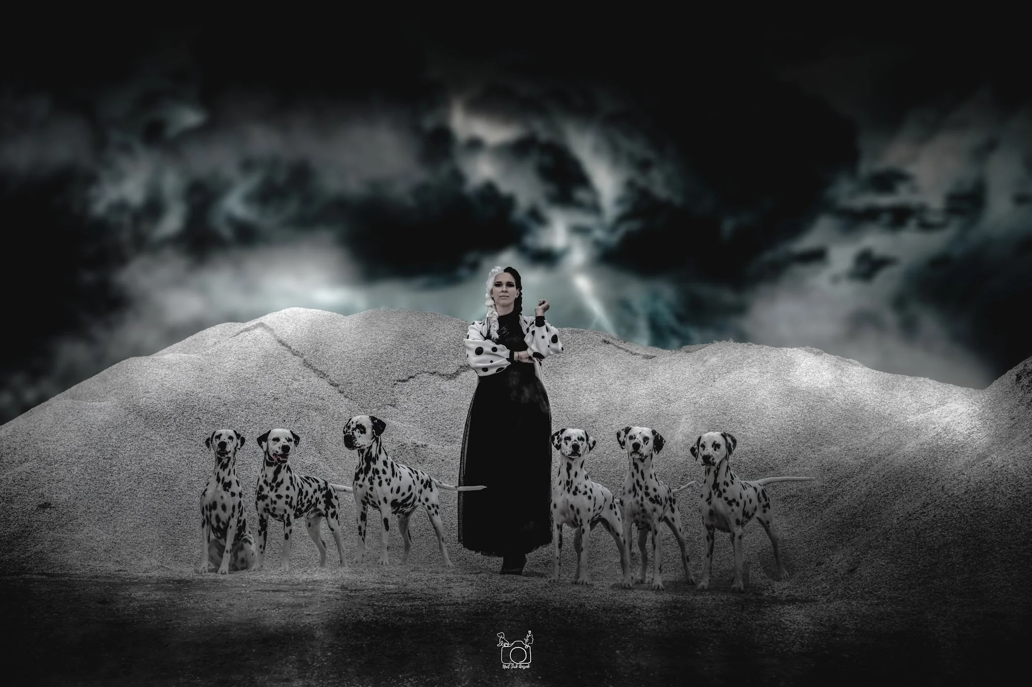 A woman dressed in a black and white polka dot dress with braided hair standing on a landscape surrounded by six Dalmatian dogs, under dark, dramatic clouds with some light breaking through.