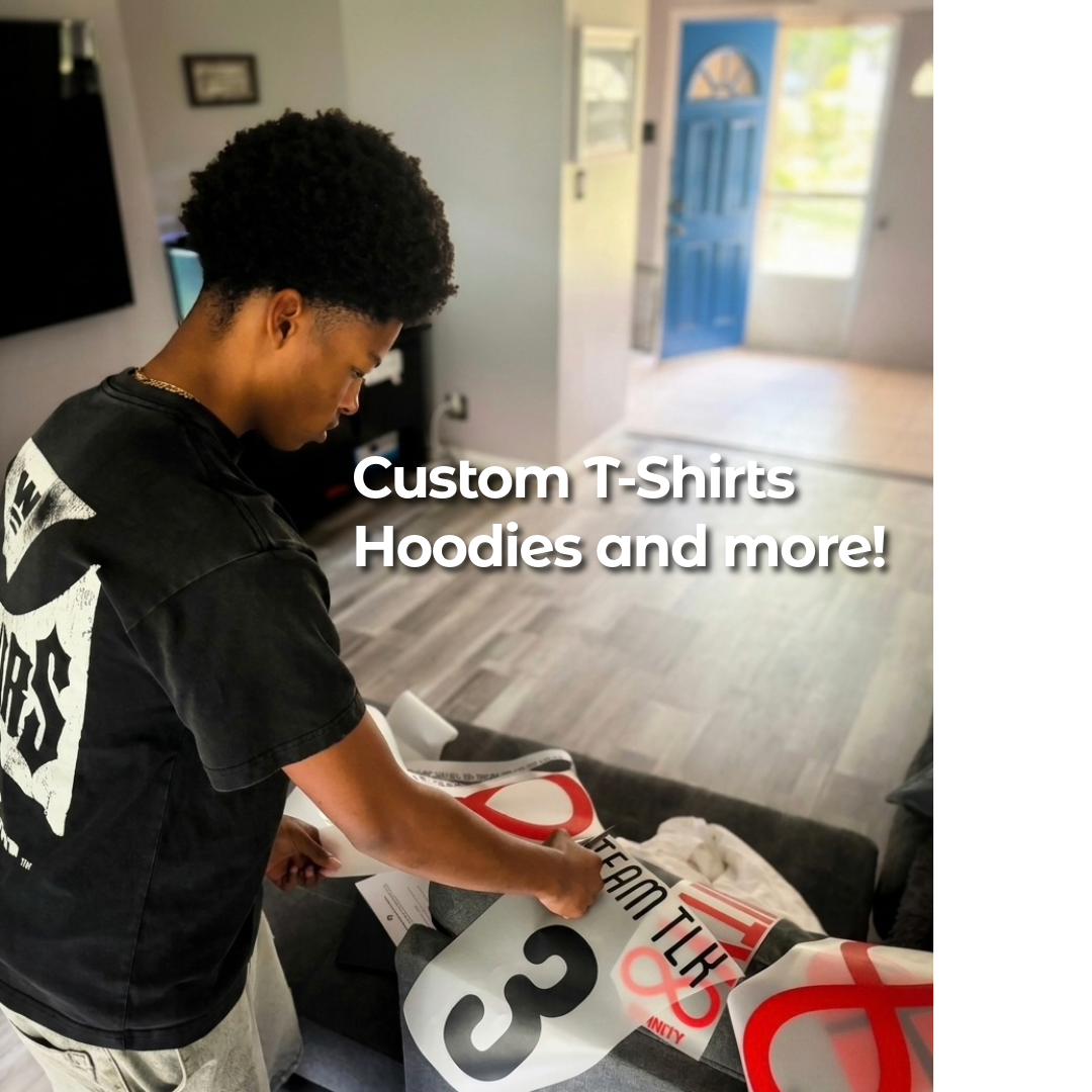 Young man preparing custom T-shirts, hoodies, and other apparel at home.