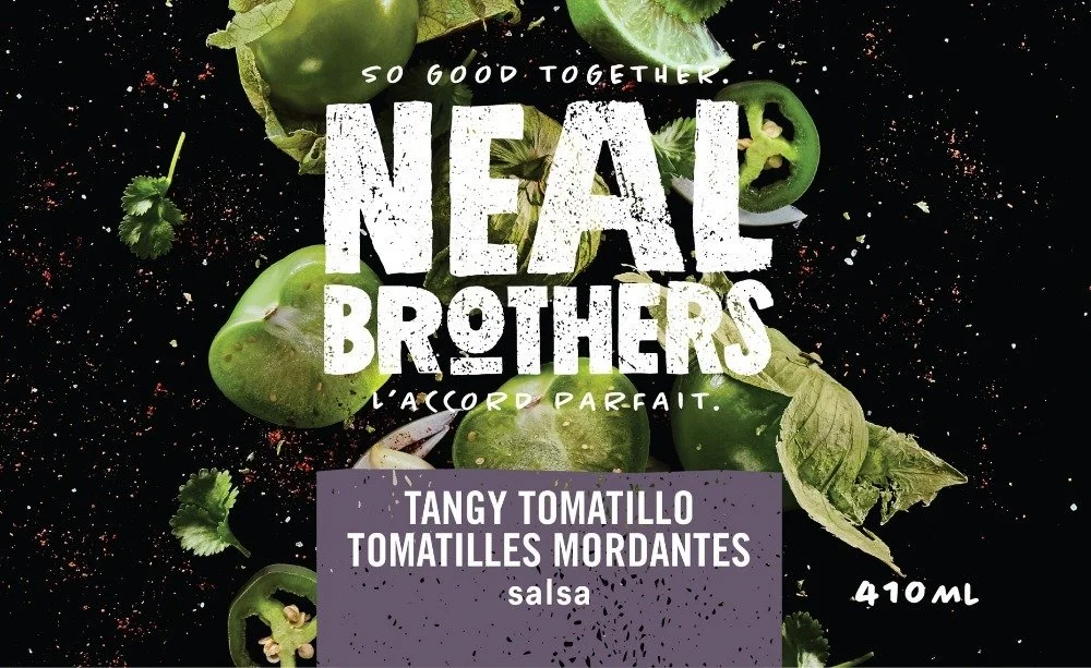 Packaging label for a sauce called "Tangy Tomatillo" with images of tomatillos, jalapeño, and cilantro on a black background. Text includes "So good together, Neal Brothers, L'accord parfait," and indicates a volume of 410ml.