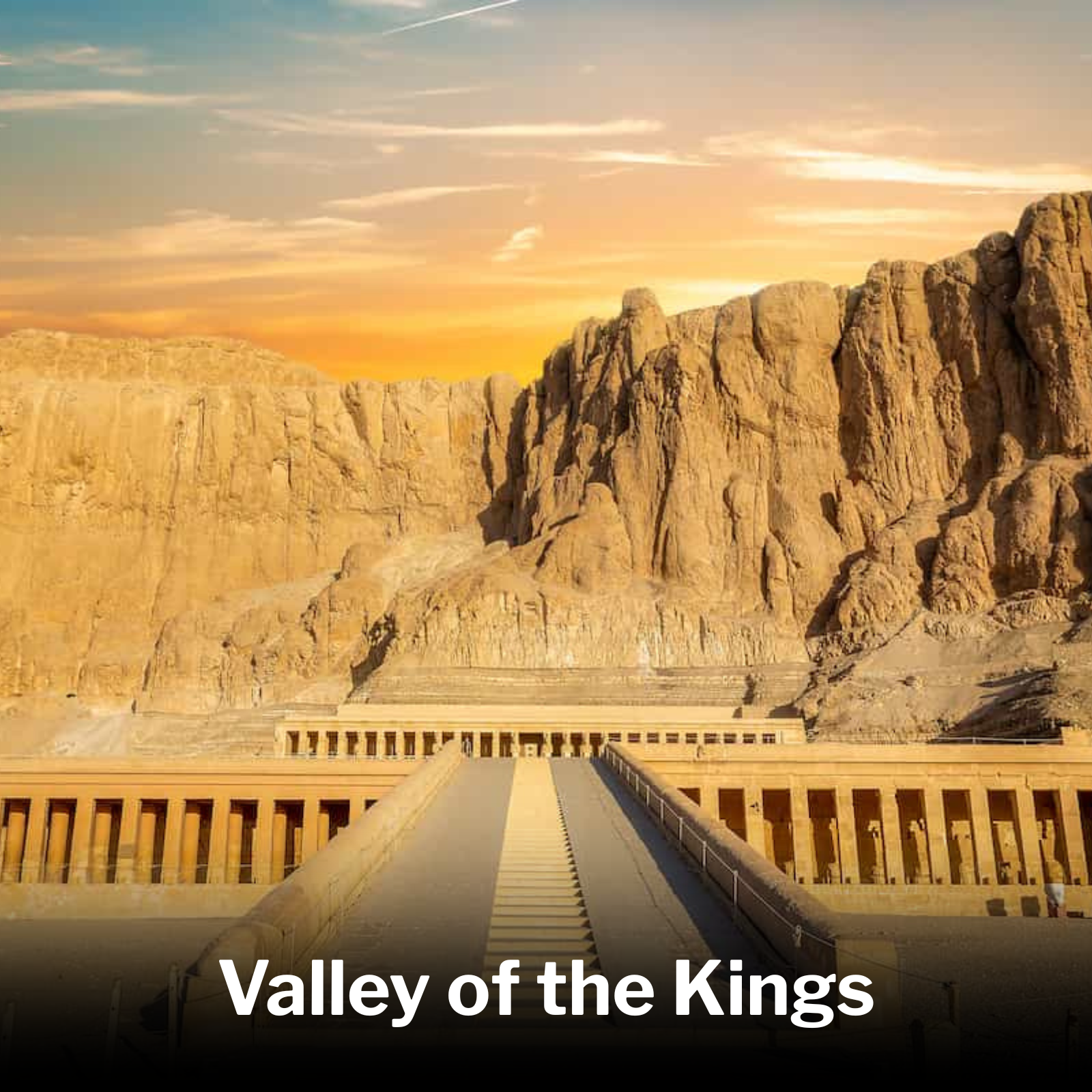 The image shows a view of Mount Rushmore with a dramatic sky at sunset. In the foreground, there is a railing along a pathway.
