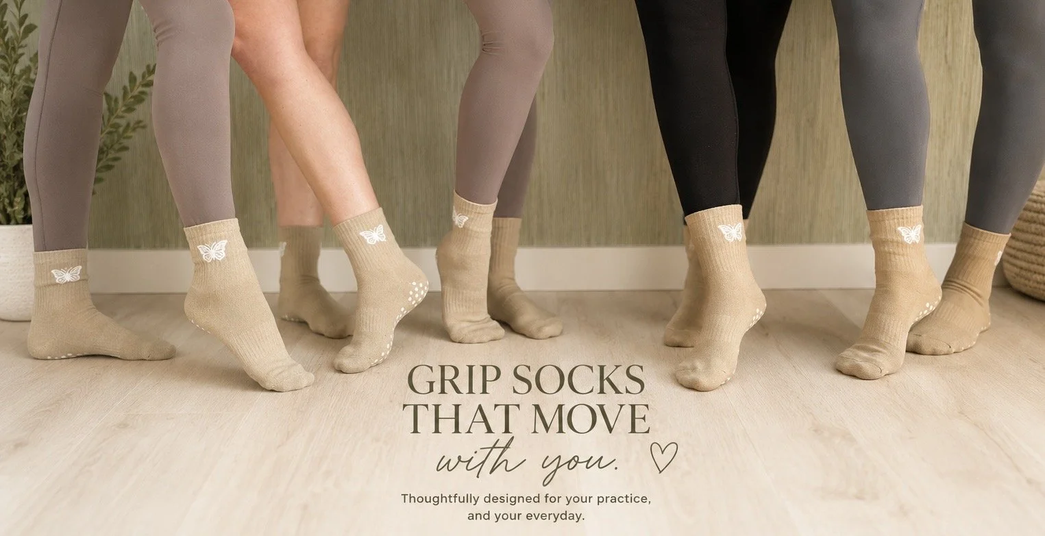 Group wearing align&co. organic cotton Pilates grip socks with butterfly details, designed for Pilates, barre, yoga, and everyday movement.