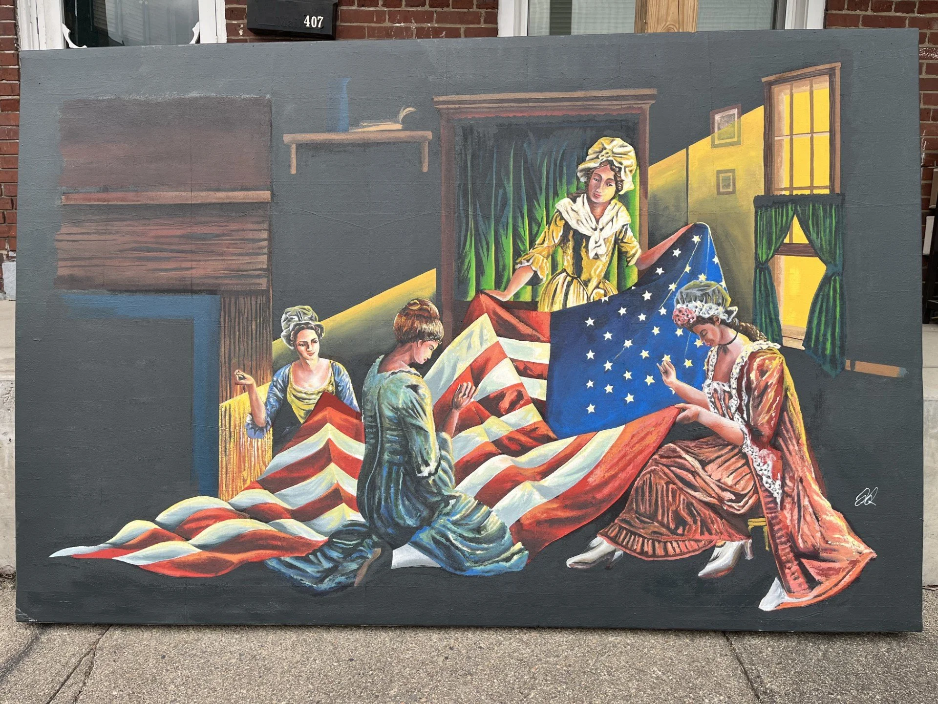 Colorful mural depicting several women in historical clothing, some holding American flags, inside a room with green curtains and window with sunlight streaming in.
