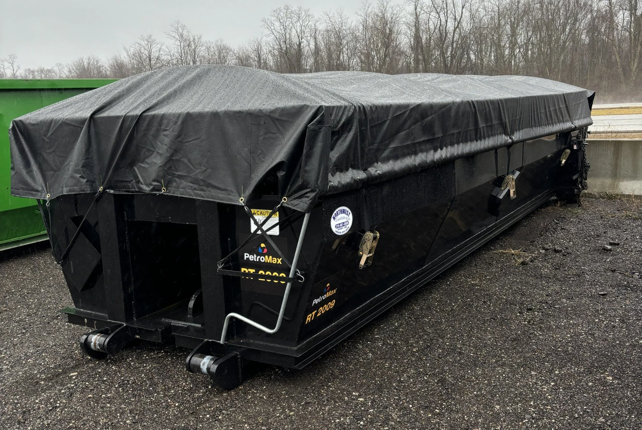 EnviroMax covered roll-off container prepared for compliant waste transportation