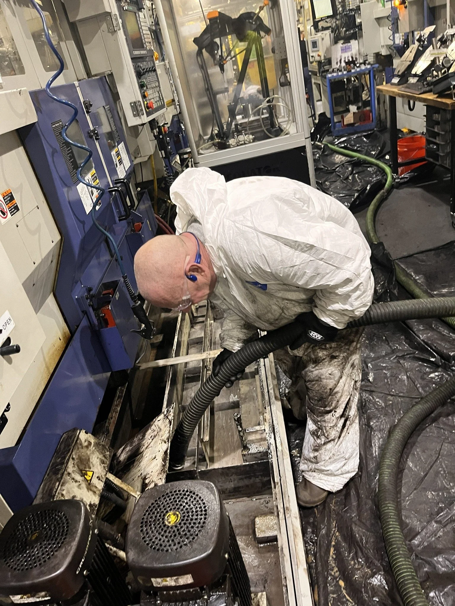 EnviroMax field technician performing industrial equipment cleanup and decontamination