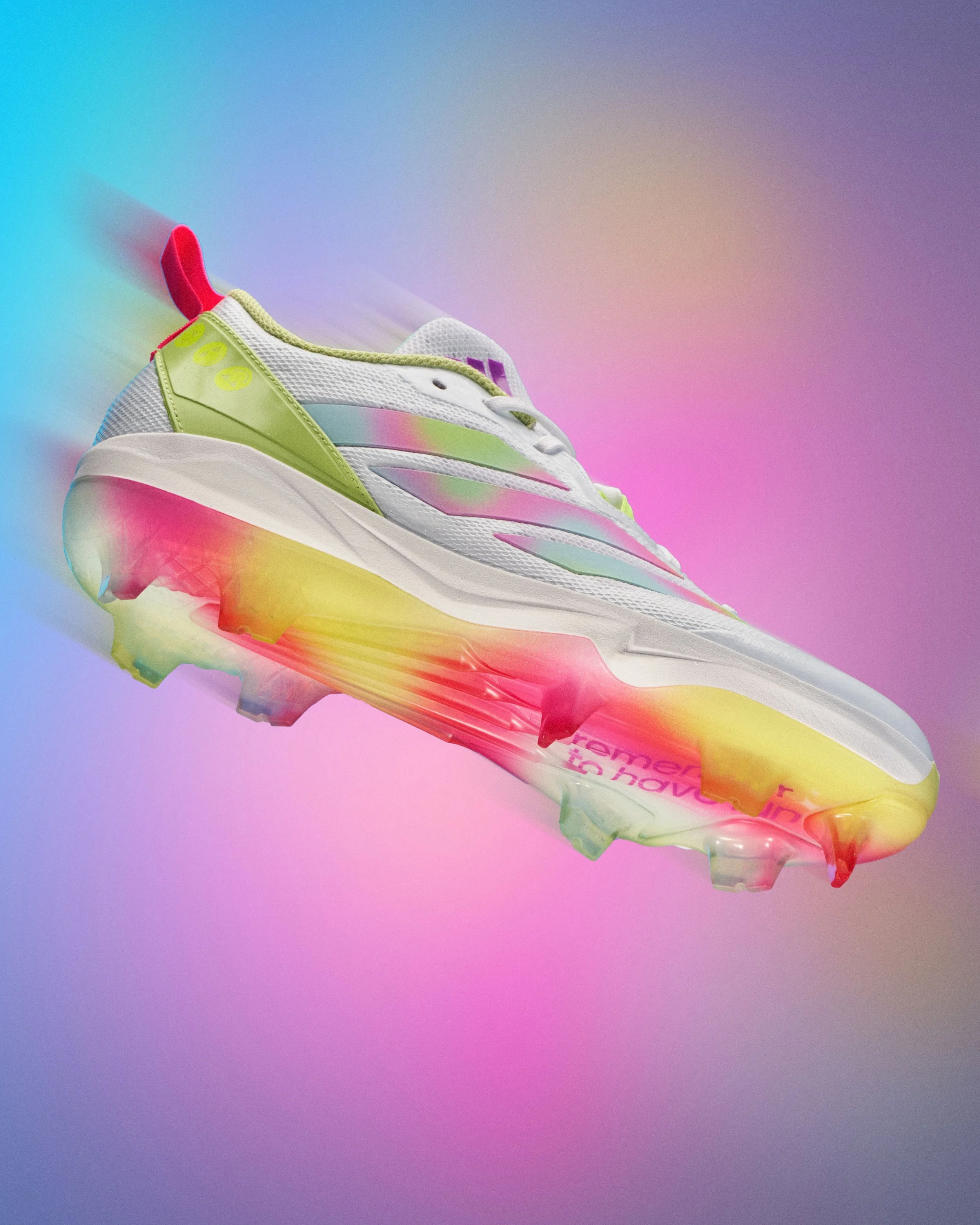 Colorful athletic shoe with rainbow gradient sole, white mesh upper, neon yellow accents, and pink pull tab, displayed against a pastel rainbow background.