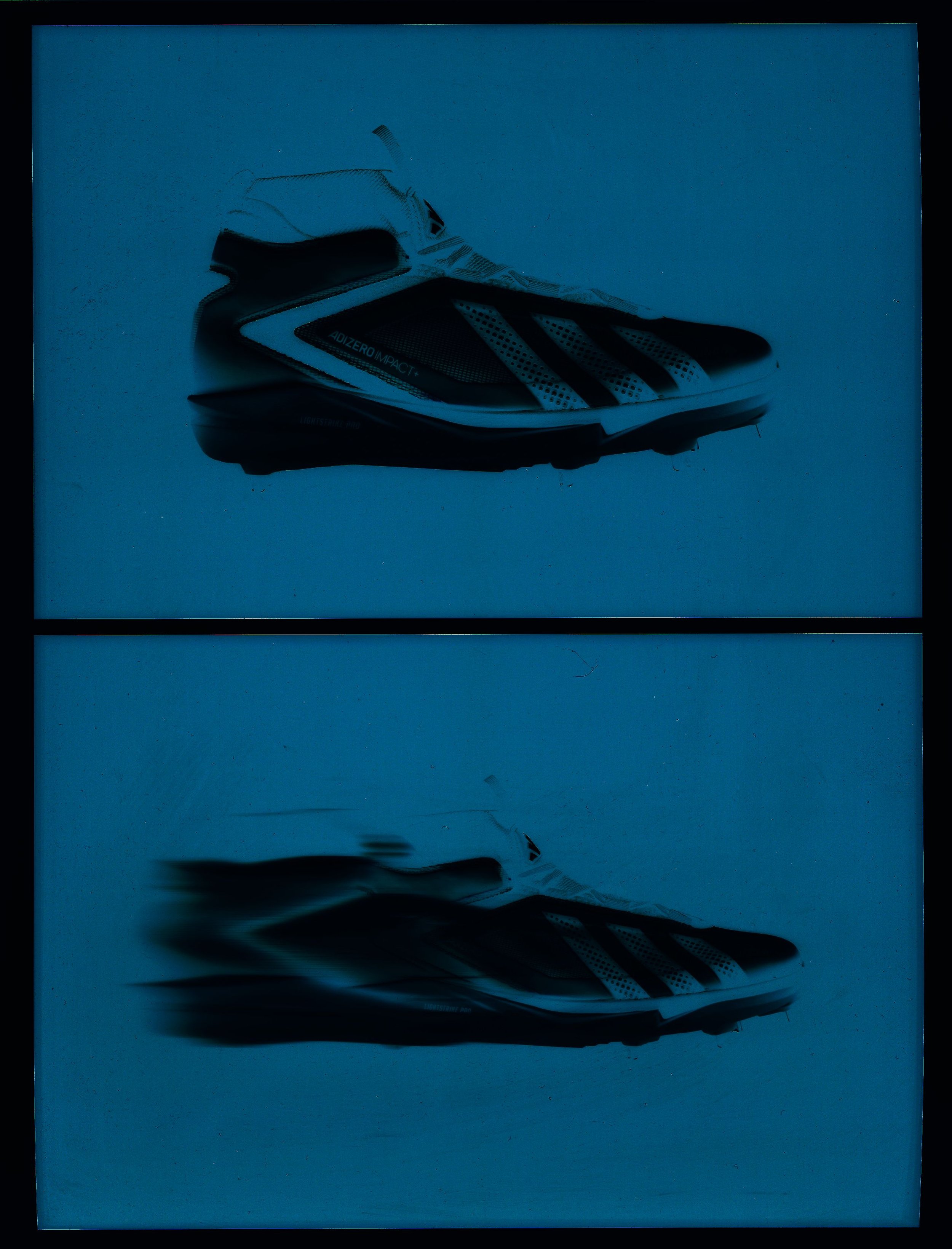 A black and white athletic shoe with a patterned strap and branding on the side, placed on a reflective surface that mirrors the shoe.