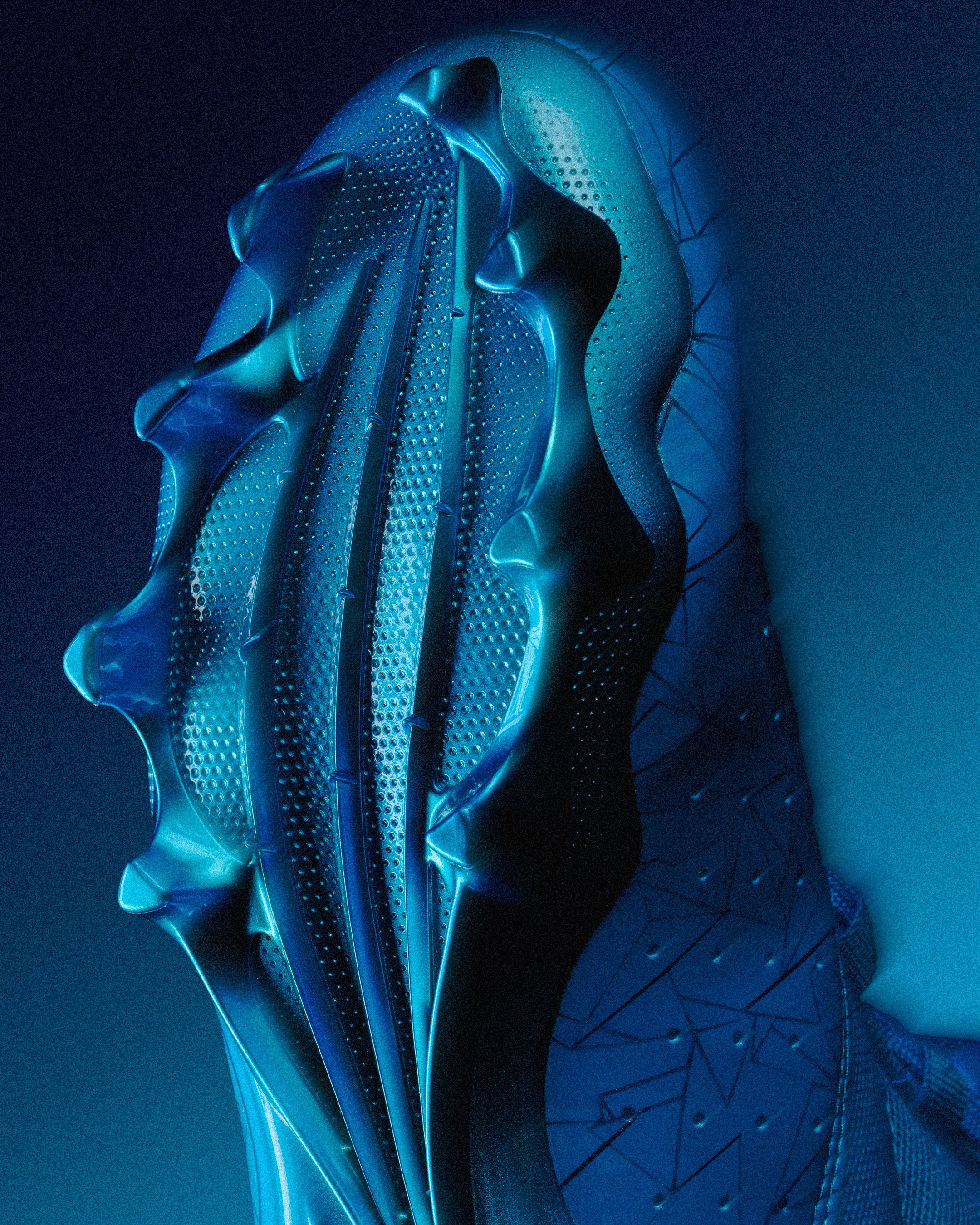 Close-up of a modern, metallic football helmet with blue lighting and intricate design details.