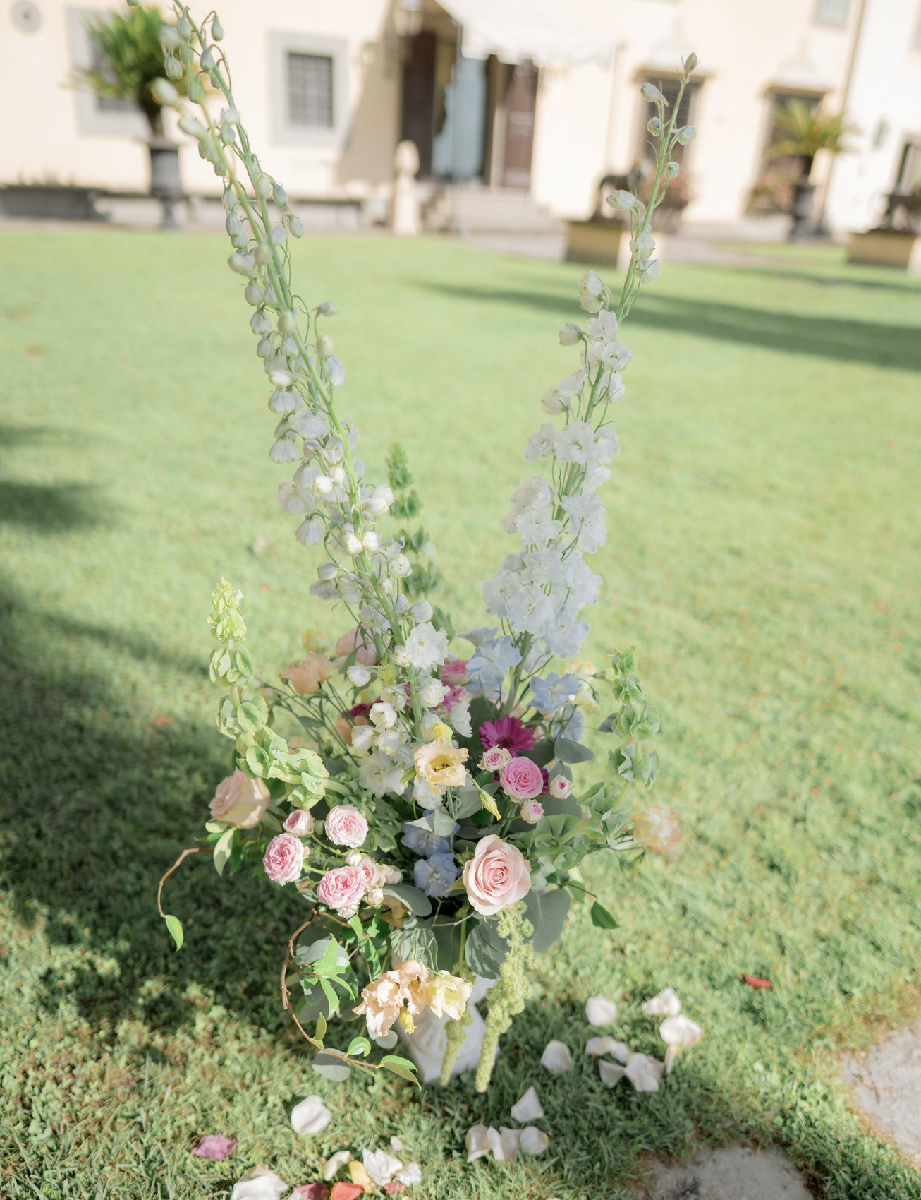 Colorful floral arrangement displayed on a lawn at an Italian wedding venue in Florence Italy
