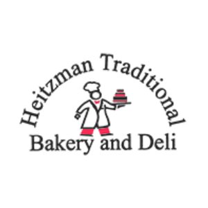 Logo of Heitzman Traditional Bakery and Deli featuring a baker holding a tray of baked goods.