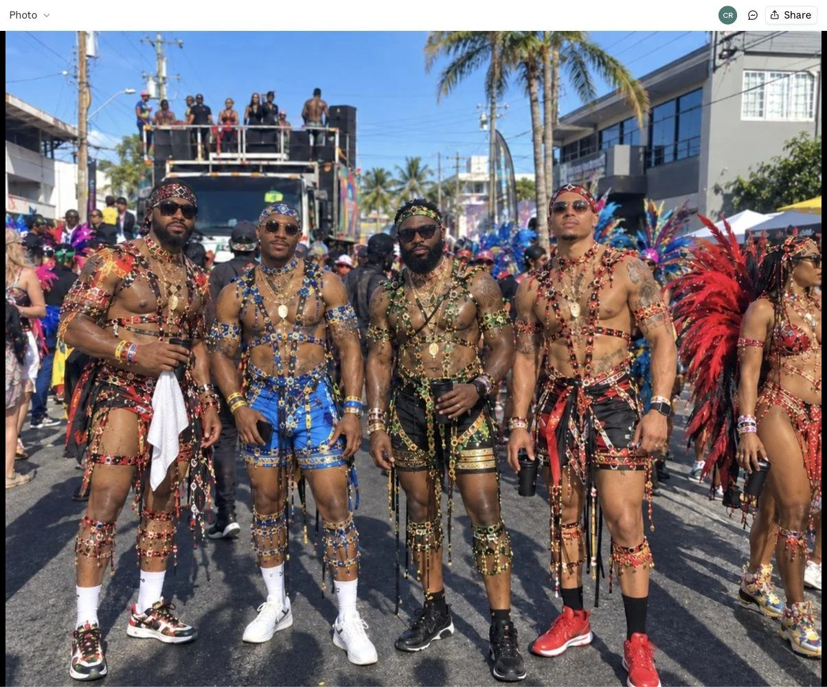 Four men in ornate beaded Carnival costumes on the road