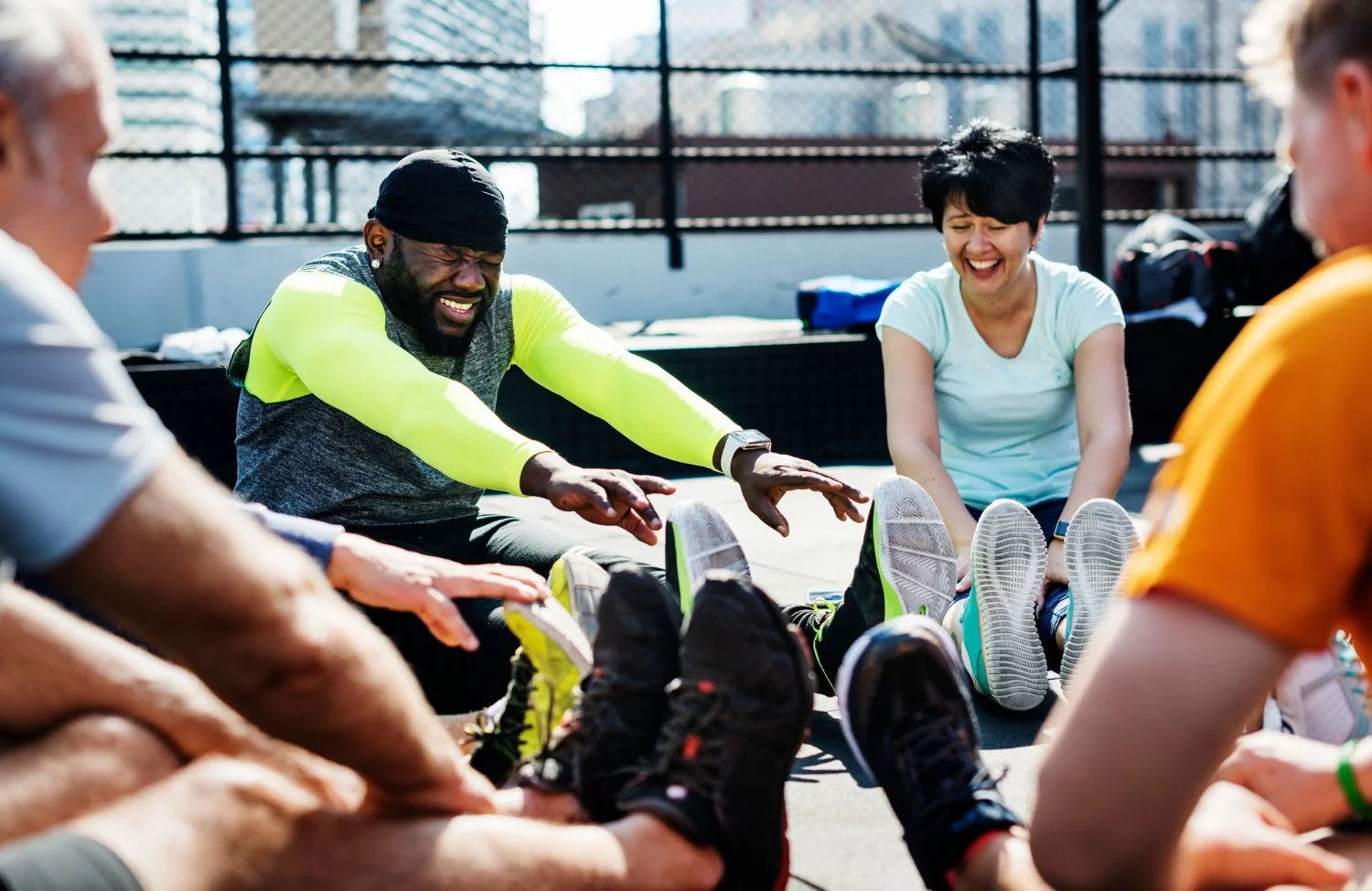 Run Collective UK team members stretching together before a corporate running session