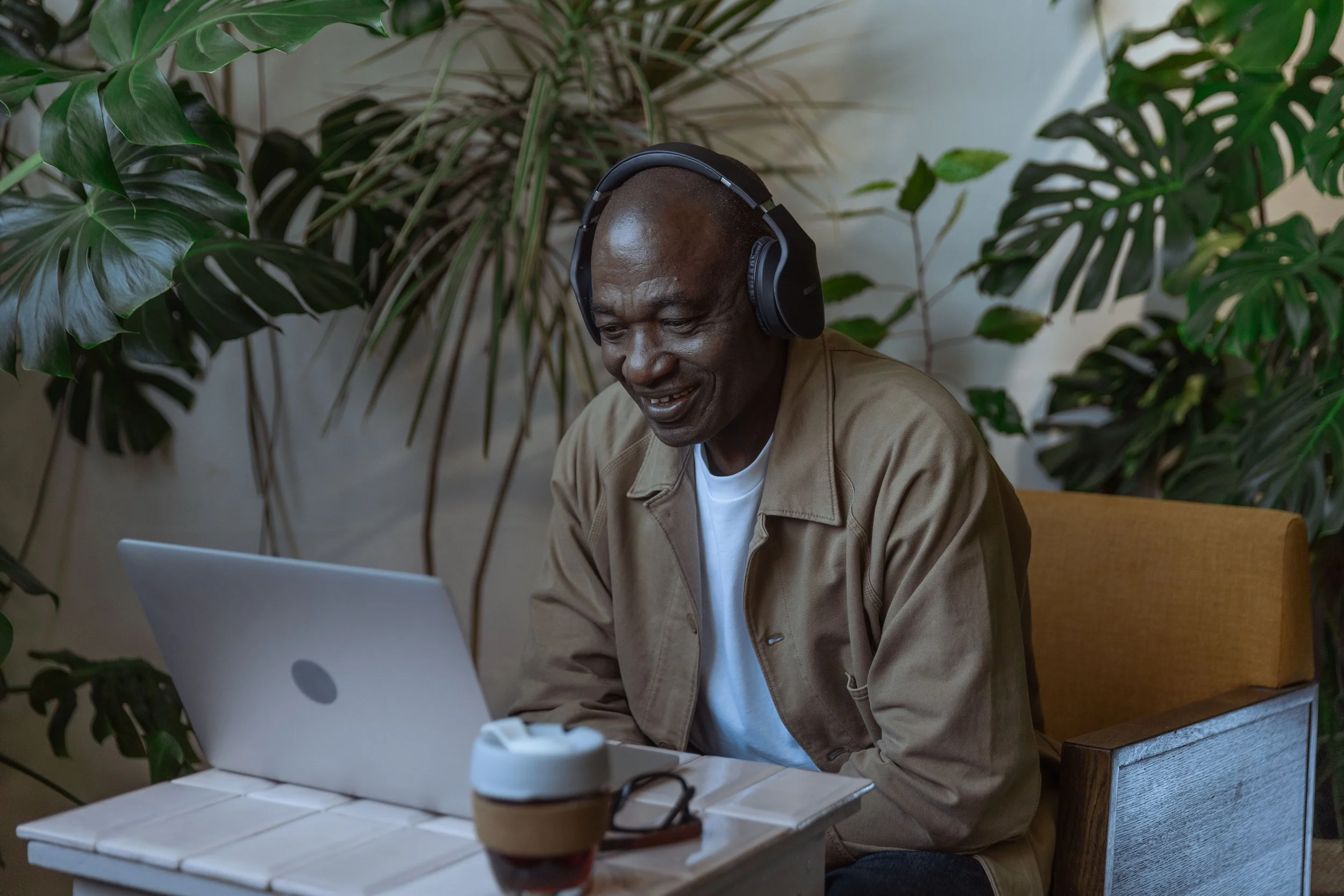 A man participating in an online therapy session