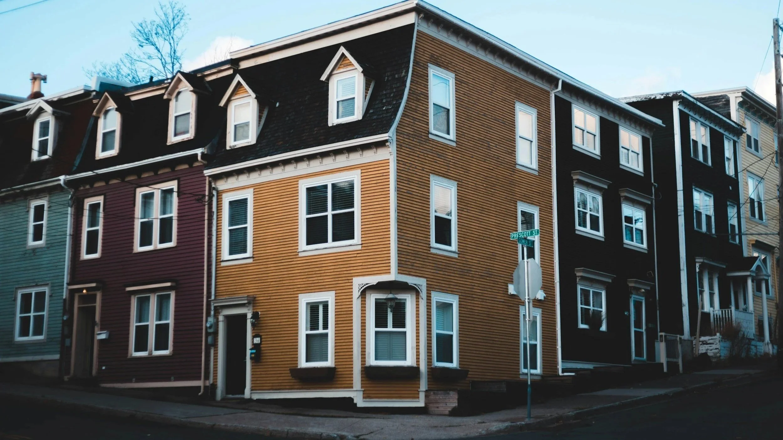 Colorful residential buildings on a neighborhood street