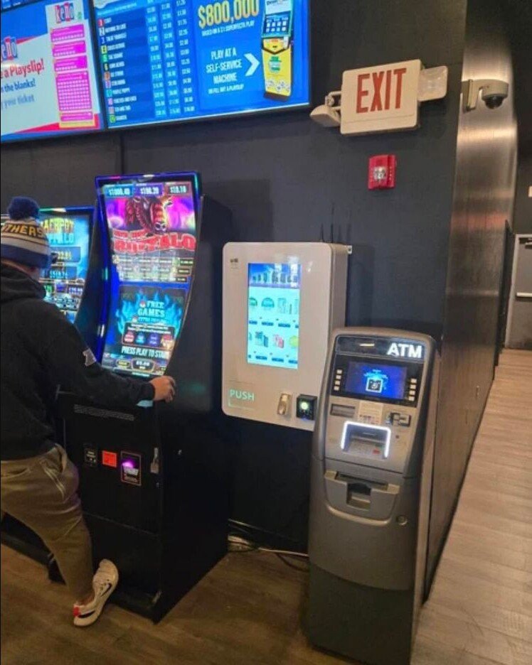 Modern touchscreen vending machine placed inside an entertainment and gaming venue.