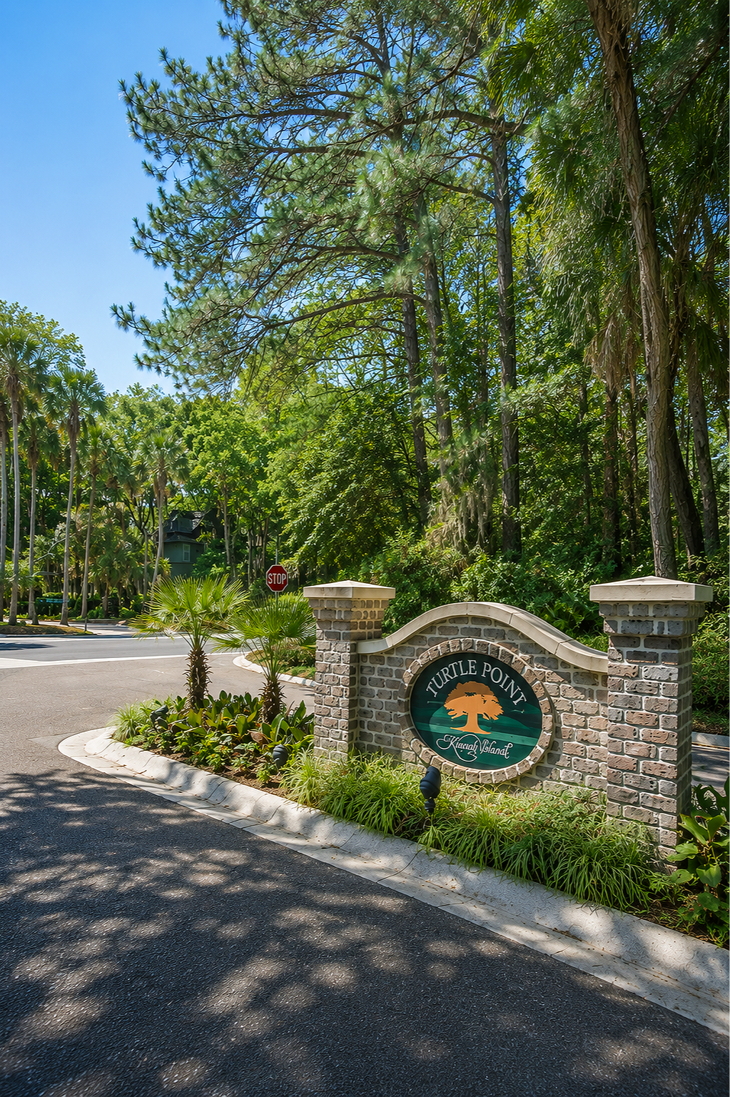 Sign for Turtle Point at Keyahuna Island, surrounded by lush green trees and landscaping, on a sunny day.