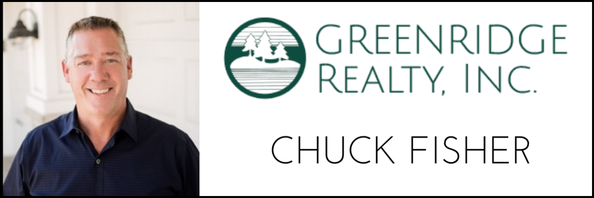 A portrait of Chuck Fisher smiling, with a logo of Greenridge Realty, Inc. and his name on a professional sign.