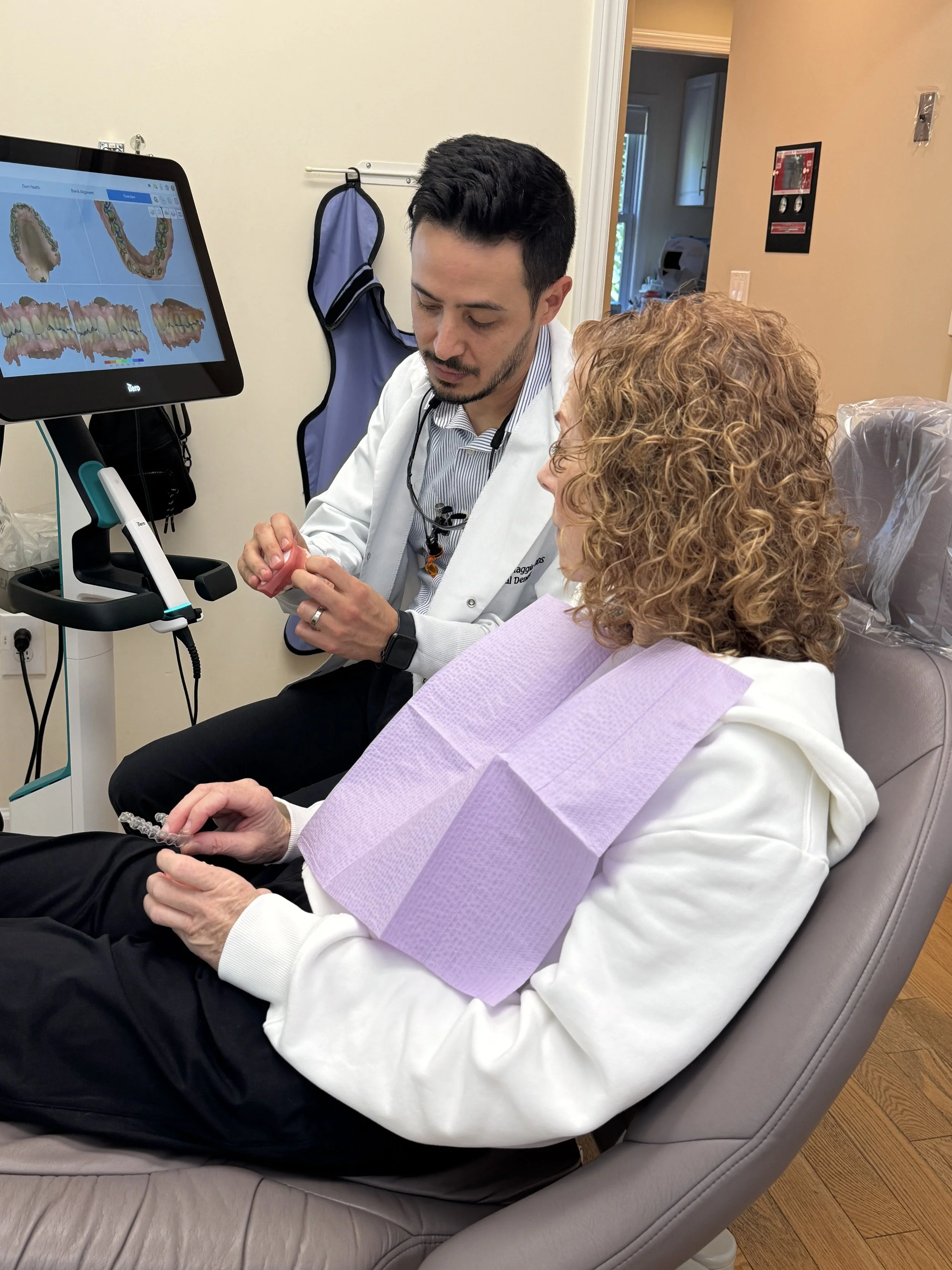 Dr. DiMaggio explaining Invisalign to patient.