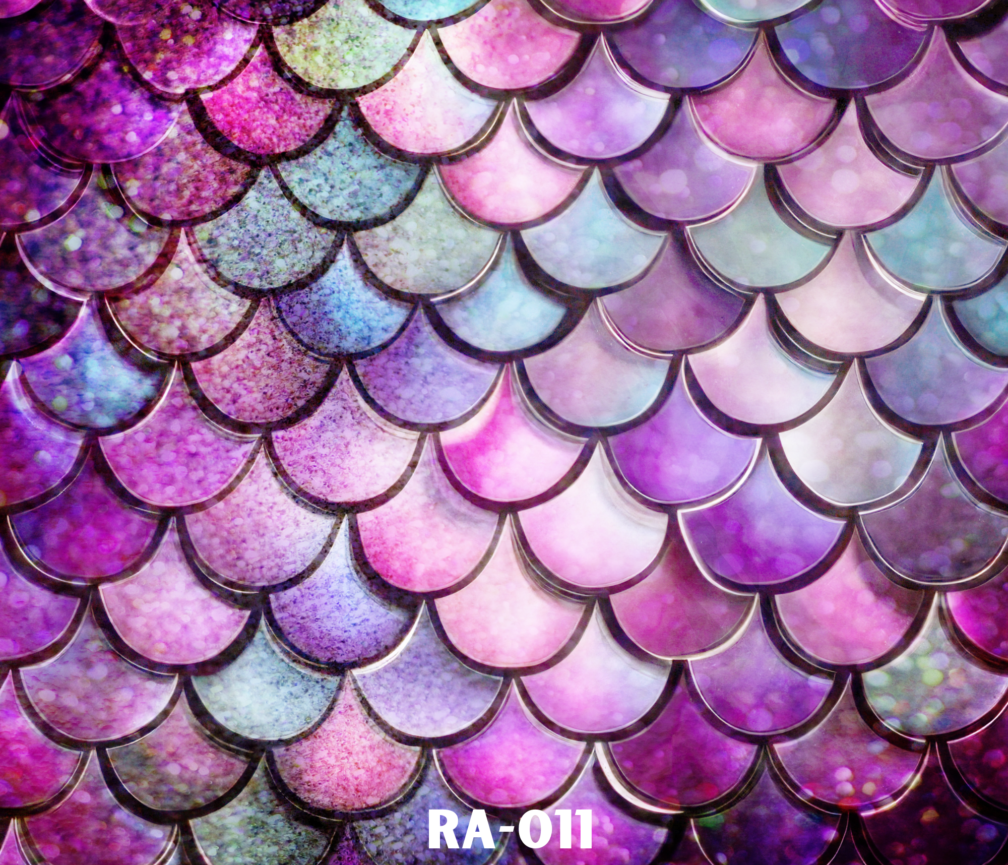 Close-up of colorful, overlapping, iridescent scales with a rainbow holographic effect.