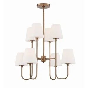 A modern chandelier with ten white lampshades and a brass finish.