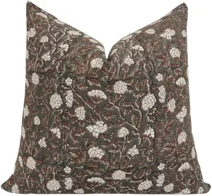 Decorative pillow with a floral pattern in shades of brown and white