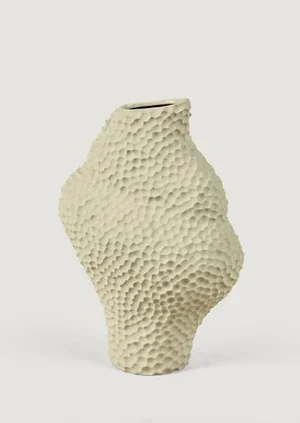 A textured beige ceramic vase with a wavy, honeycomb-like surface design.