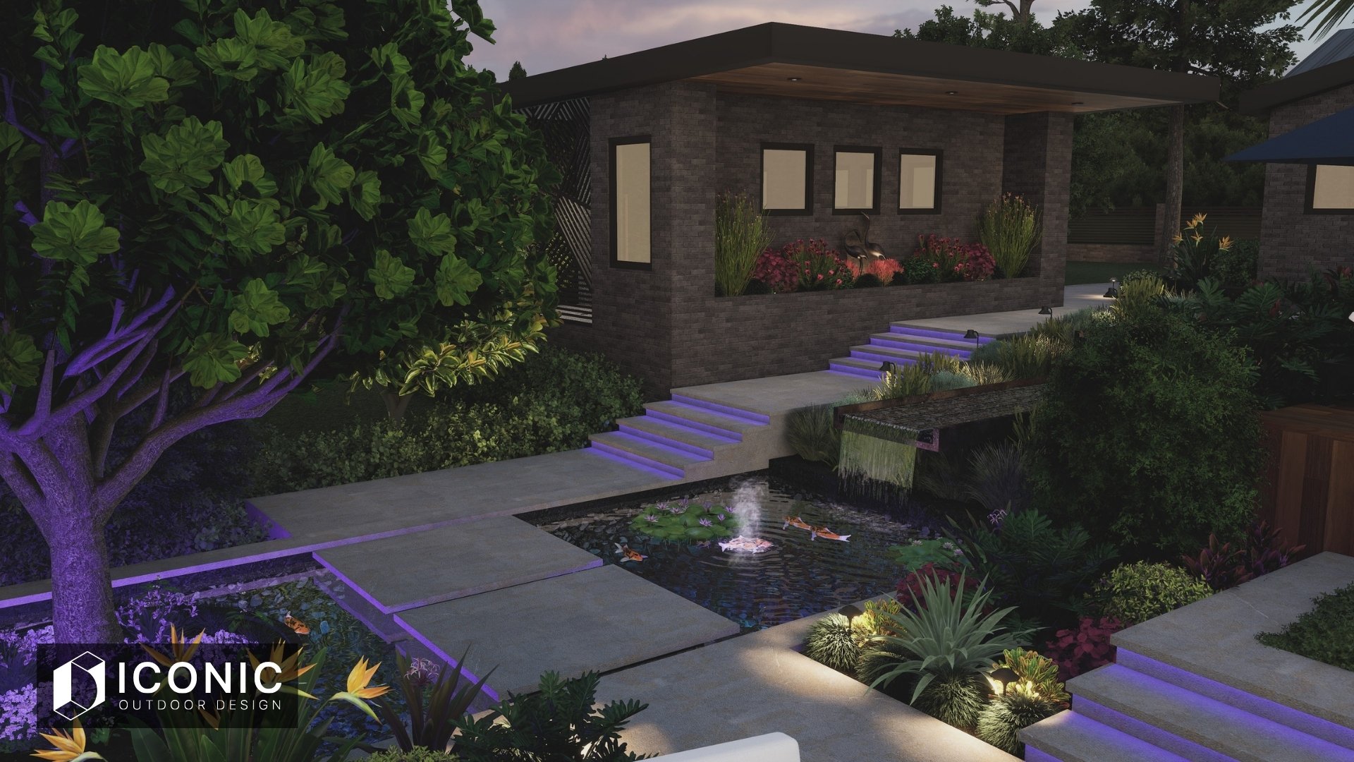 Nighttime view of a modern backyard with a small pond, water lilies, and a fountain. There are stepping stones leading to a patio with built-in purple lighting, surrounded by lush plants and trees, including a large tree with purple lighting on its trunk. A brick house with large windows and an outdoor seating area is visible in the background.