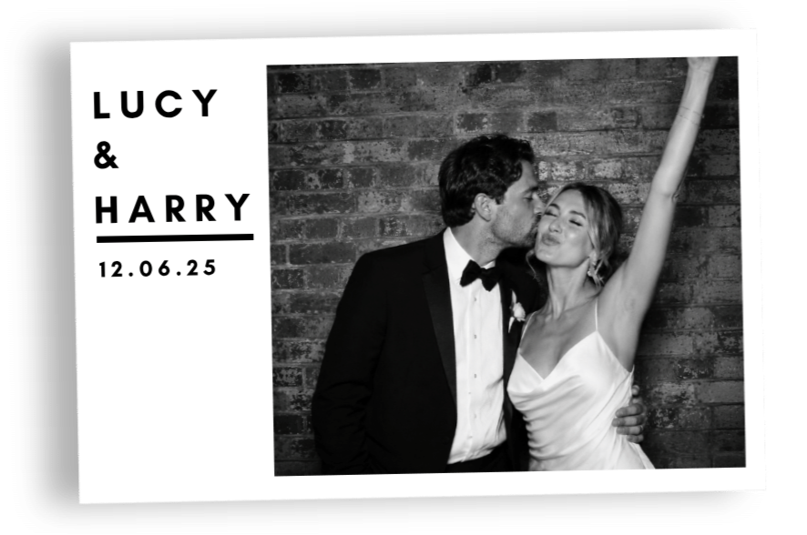 Black and white photo of a newlywed couple, with the groom kissing the bride's cheek as they pose in front of a brick wall. The bride has her arm raised and is smiling with her eyes closed. The left side of the image has text that reads 'LUCY & HARRY' and the date '12.06.25'.