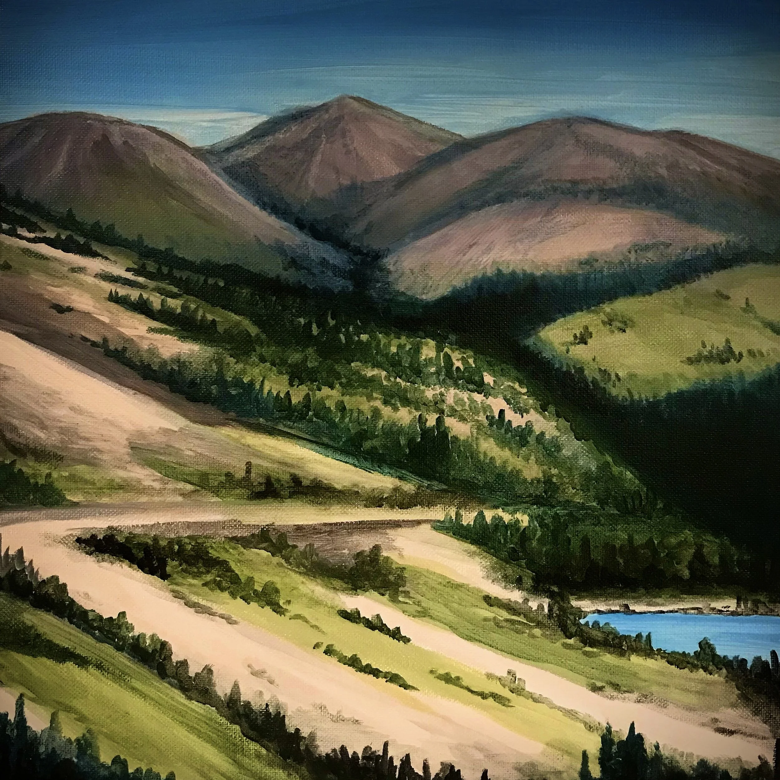Painting of a mountain landscape with rolling hills, trees, and a lake under a cloudy sky.