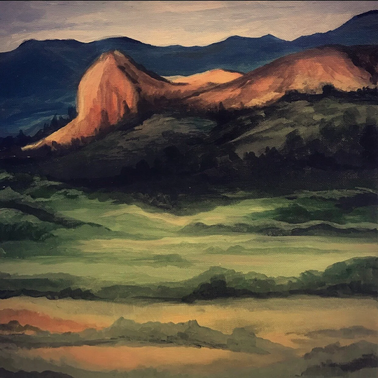 A landscape painting of rolling green hills and distant mountains with rocky formations at sunset.