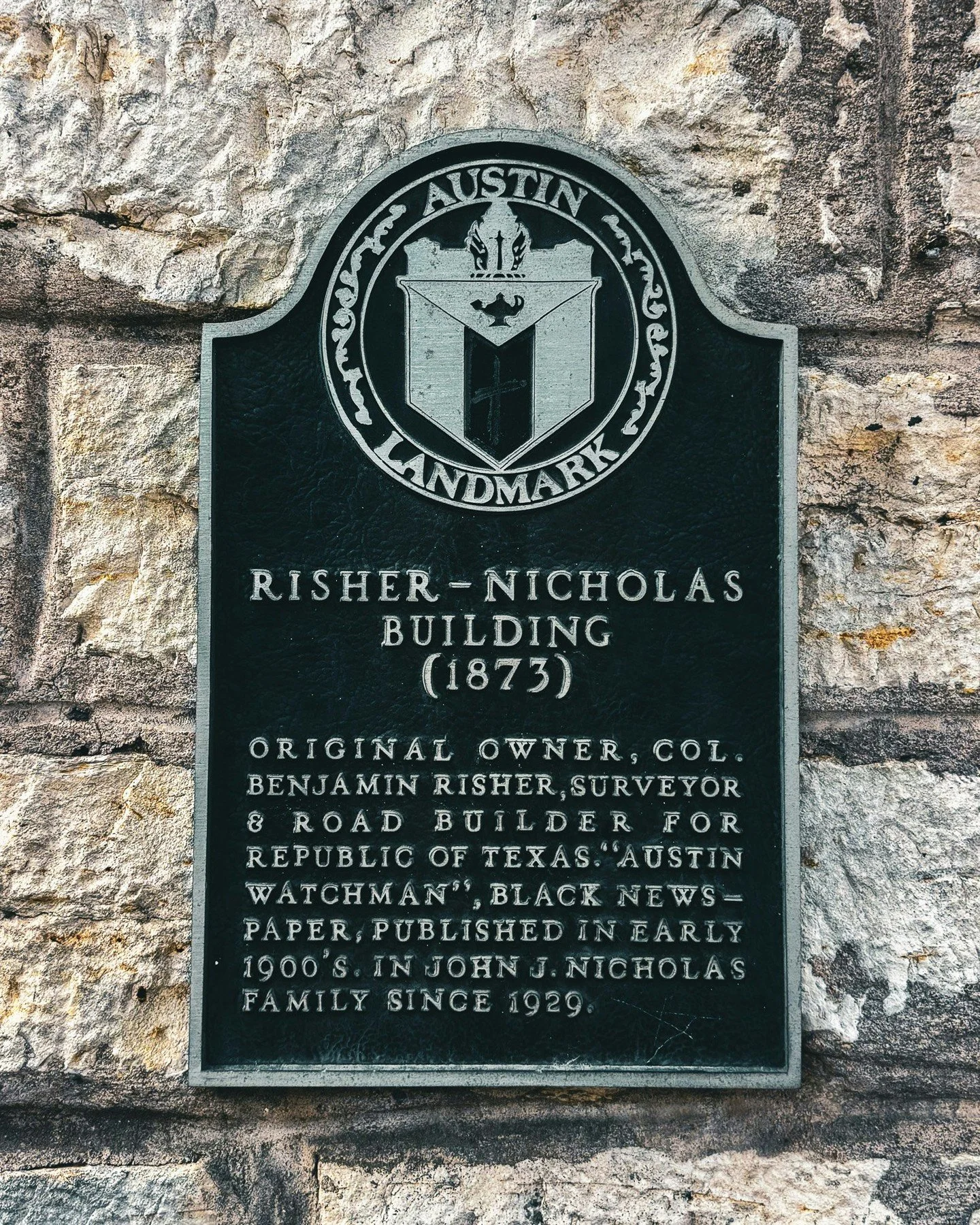 Walk 6th, and you'll start noticing the markers. Nearly every building carries one, and together they read like a list of Austin firsts.

The Austin Watchman, a Black newspaper published in the early 1900s, Risher-Nicholas Building. E.H. Carrington's