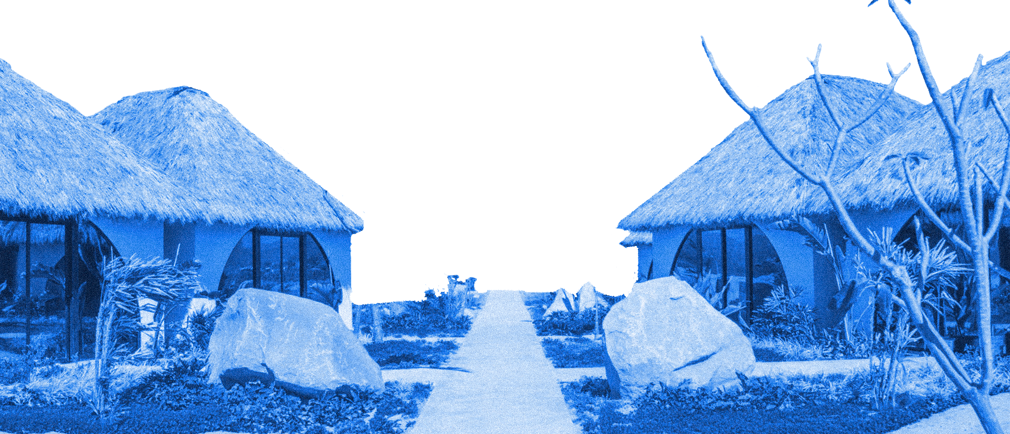 Beach huts with thatched roofs, rocks, tropical plants, and a pathway leading to the ocean in the background.