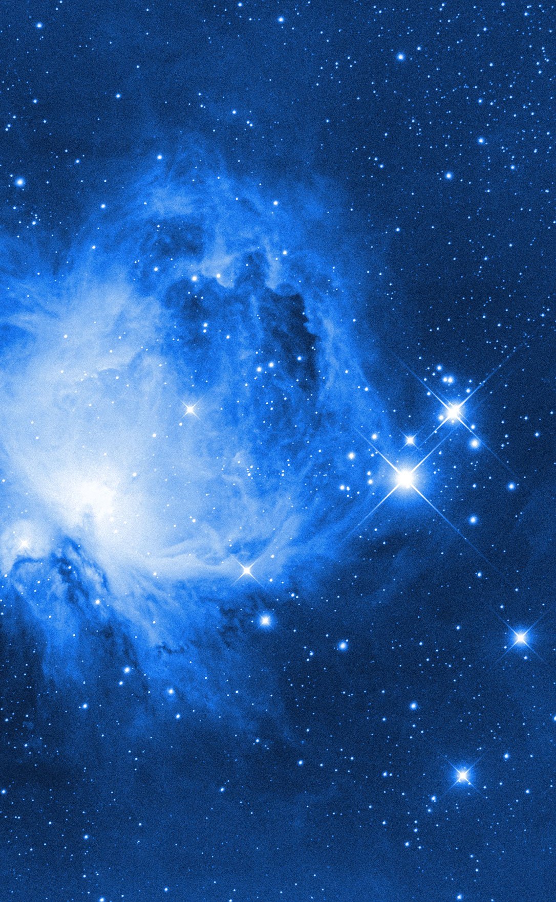 A stunning view of a colorful nebula in deep space with numerous stars scattered across the scene.