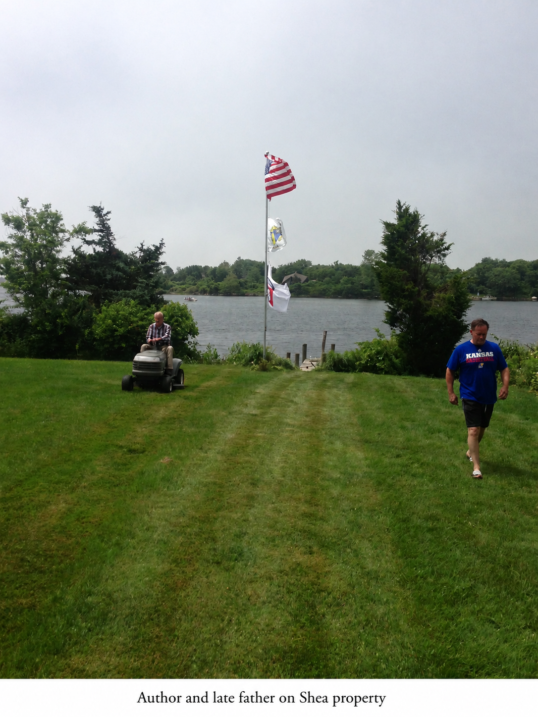 Author and late father riding lawnmower on front lawn of Shea-Cline family property.