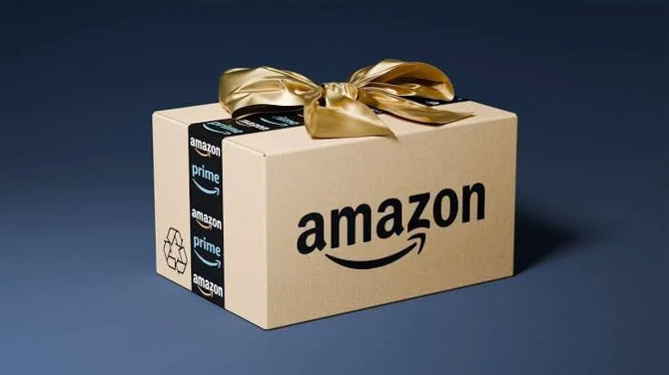 Amazon Prime package wrapped with a gold ribbon.