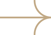 A decorative arrow with a curved tail and a pointed tip, in a beige color.