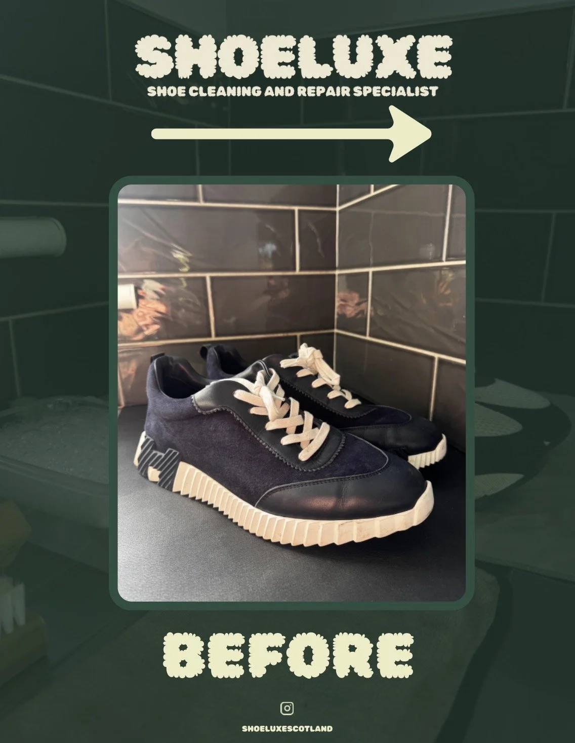 Pair of black sneakers with beige soles and white laces, placed on a black surface with a tiled wall in the background.