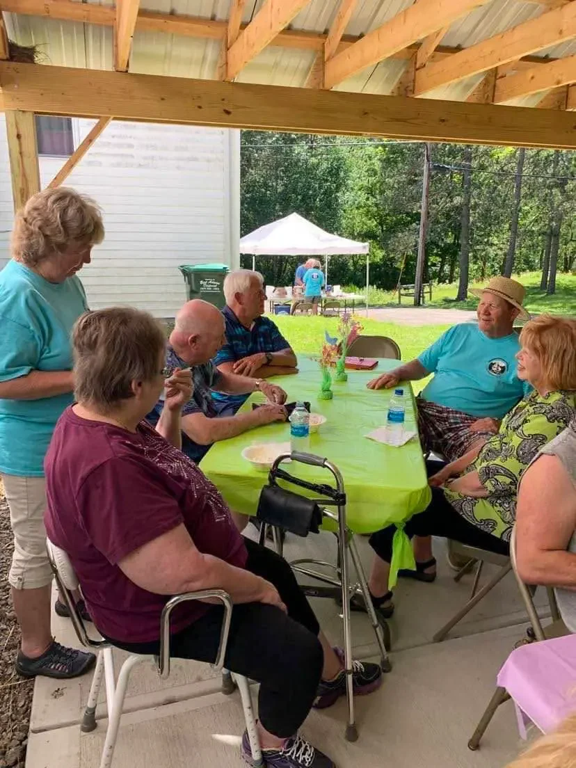 people hanging out around a table