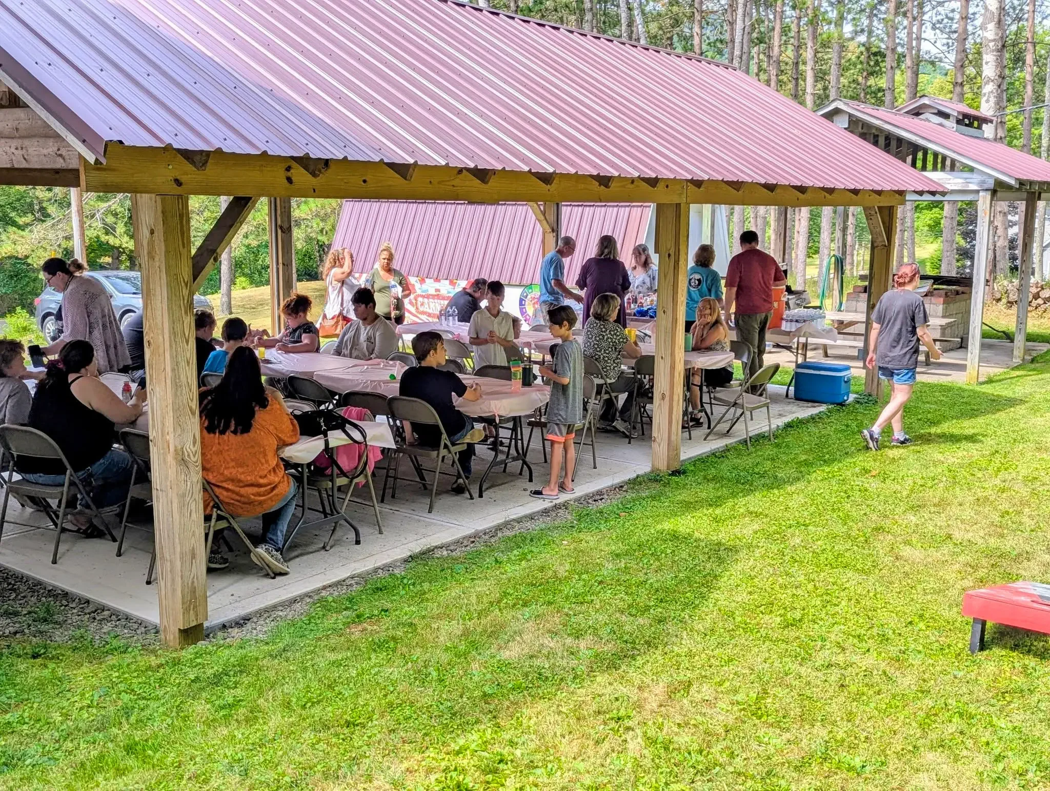 people sitting under a pavillion