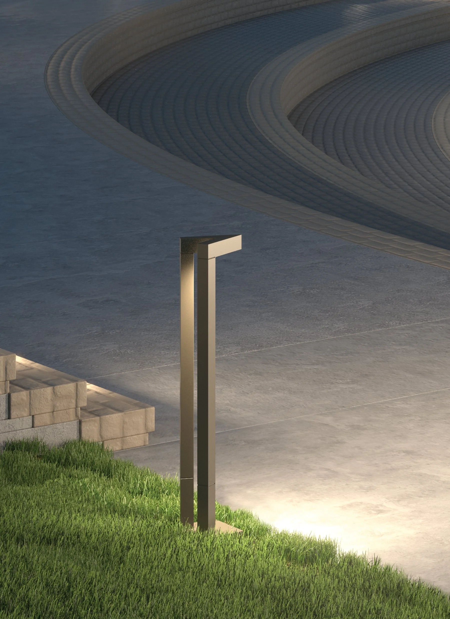 Modern rectangular outdoor light fixture beside grass and curved stone-paved steps