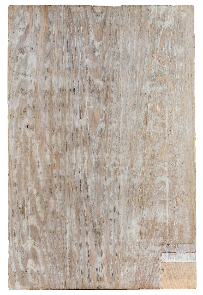 Close-up of a weathered, whitewashed wooden plank with visible grain and distressed texture
