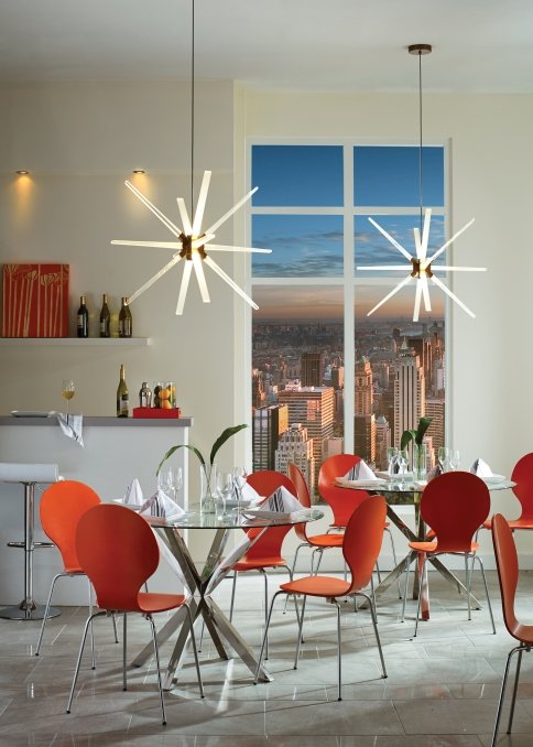 Modern dining room with red chairs, glass tables, starburst pendant lights, bar area, and city skyline view