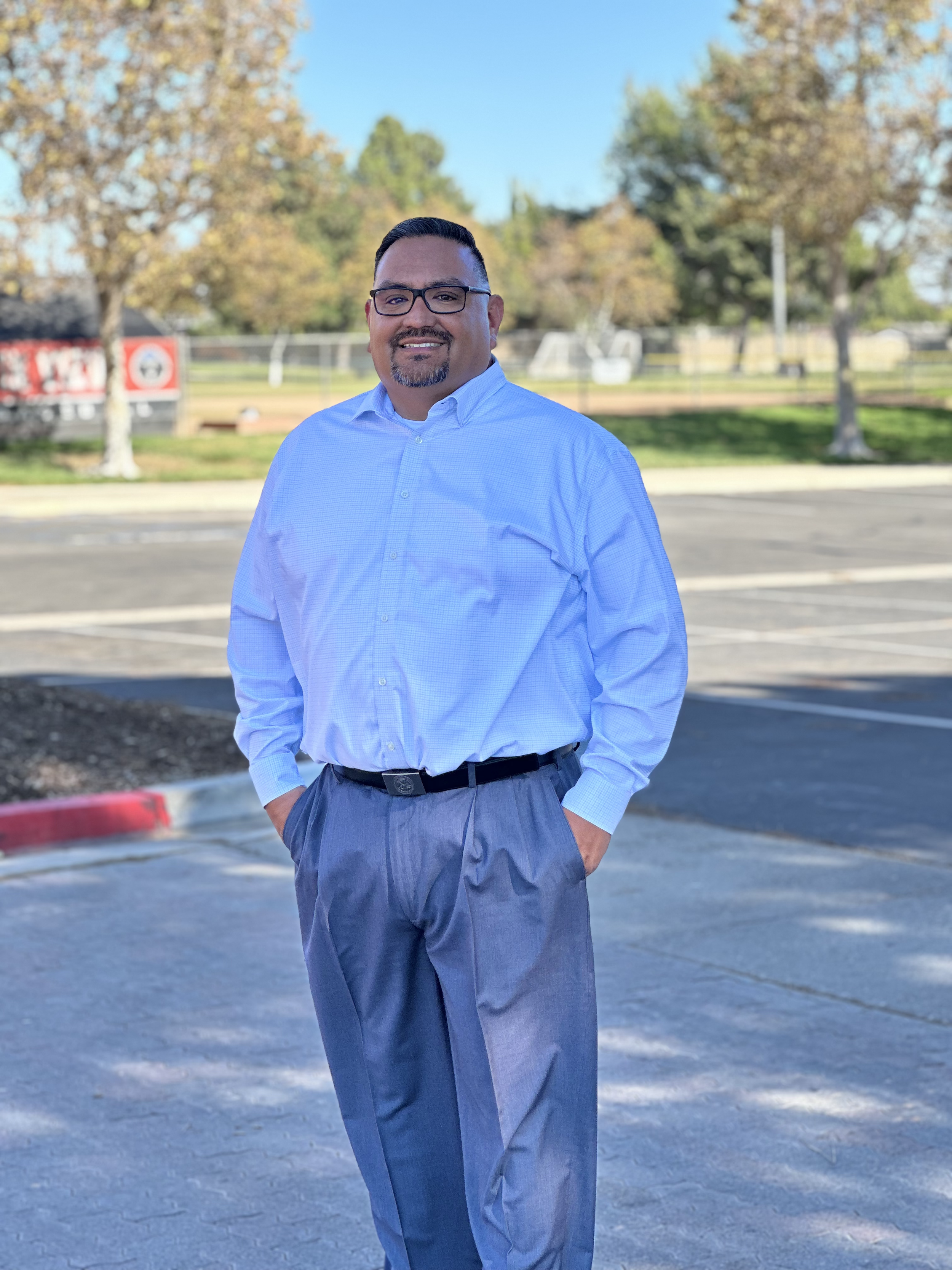 Larry Trinidad, candidate for Ontario City Council District 3, standing in an Ontario, California community park.