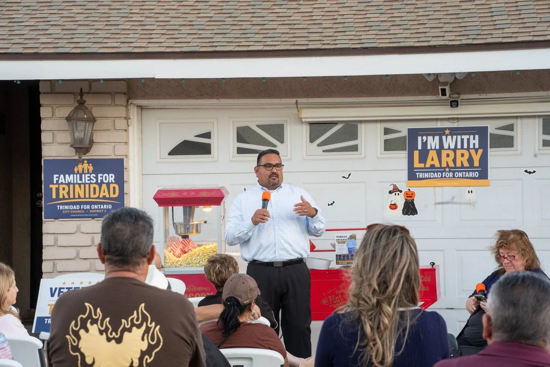 Larry Trinidad speaking with neighbors at a District 3 meet and greet in Ontario