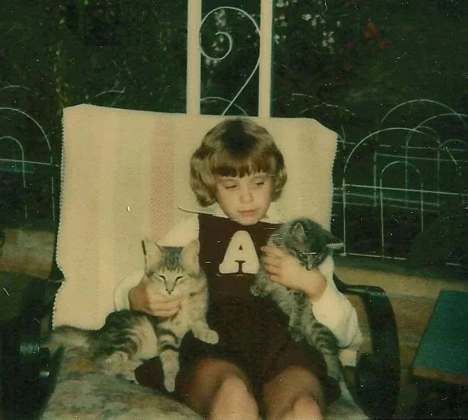 Jenn sitting on Granny’s porch. Circa 1980.