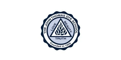 School emblem for John Thomas Dye School featuring a flame symbol and the words Love, Beauty, Truth, founded in 1928.