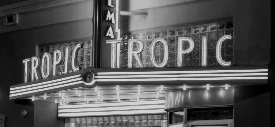 The marquee sign of a nightclub or theater displaying the word "TROPIC" in neon lights.