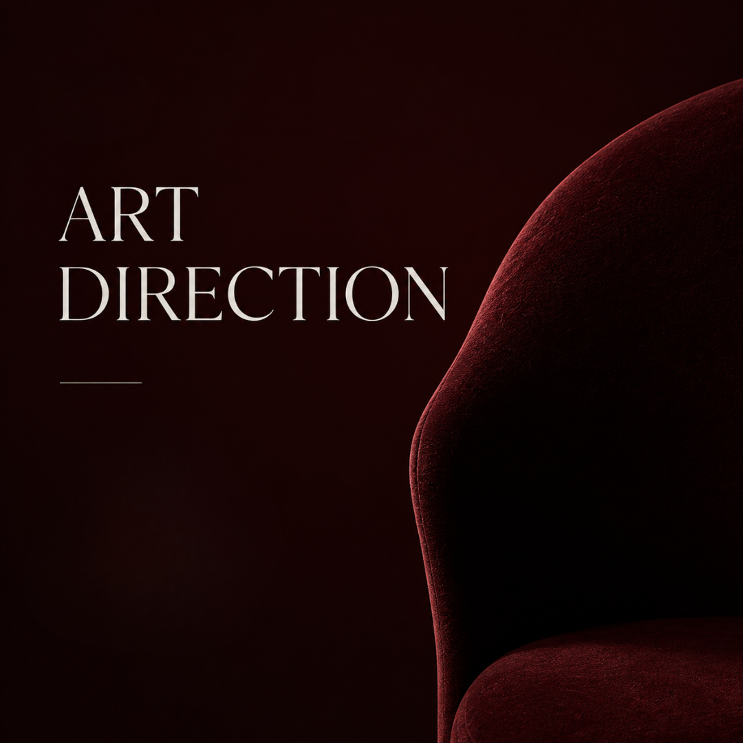 Dark red velvet armchair with text 'Art Direction' on a black background.