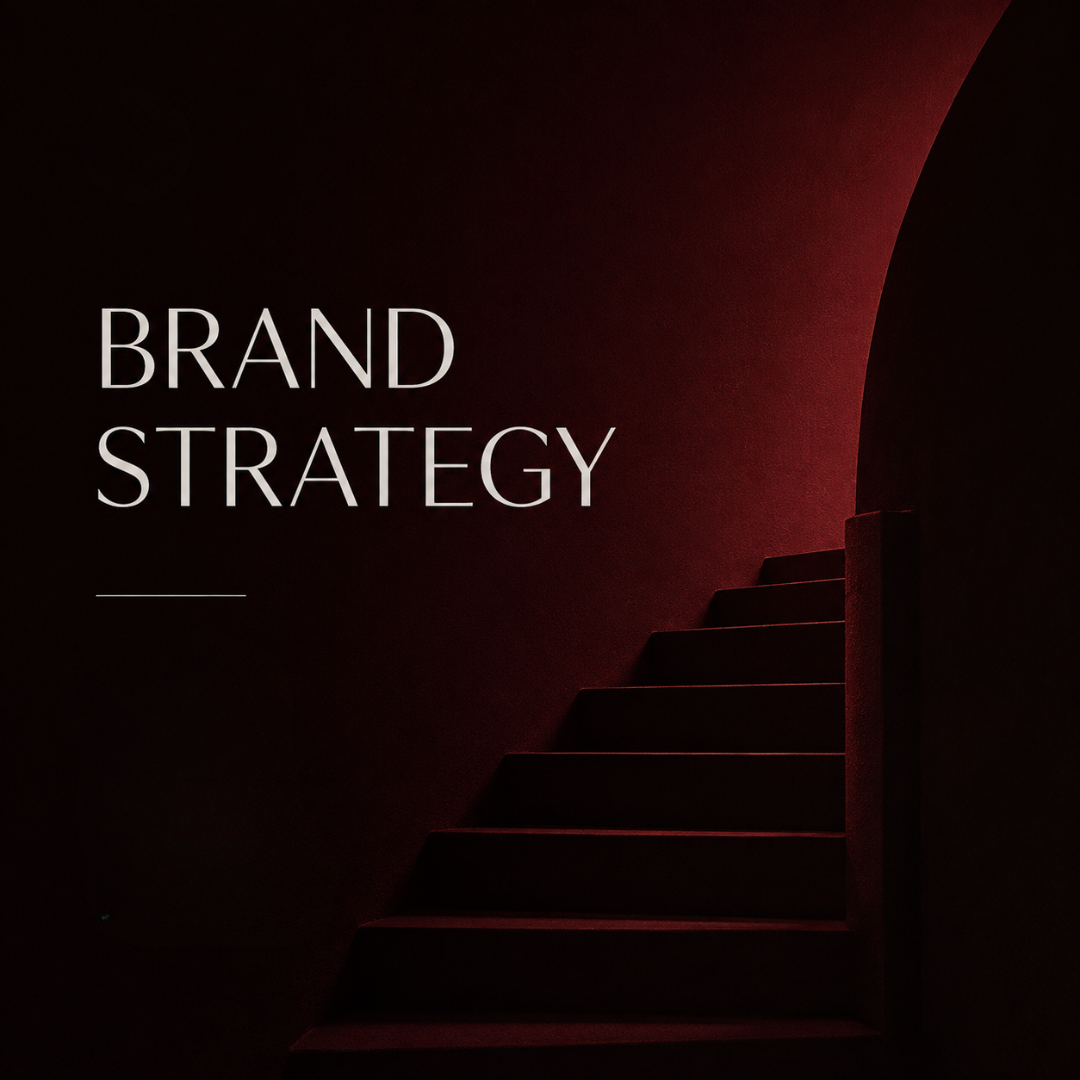 Dark staircase leading upward next to a wall with the text 'Brand Strategy' in white letters.