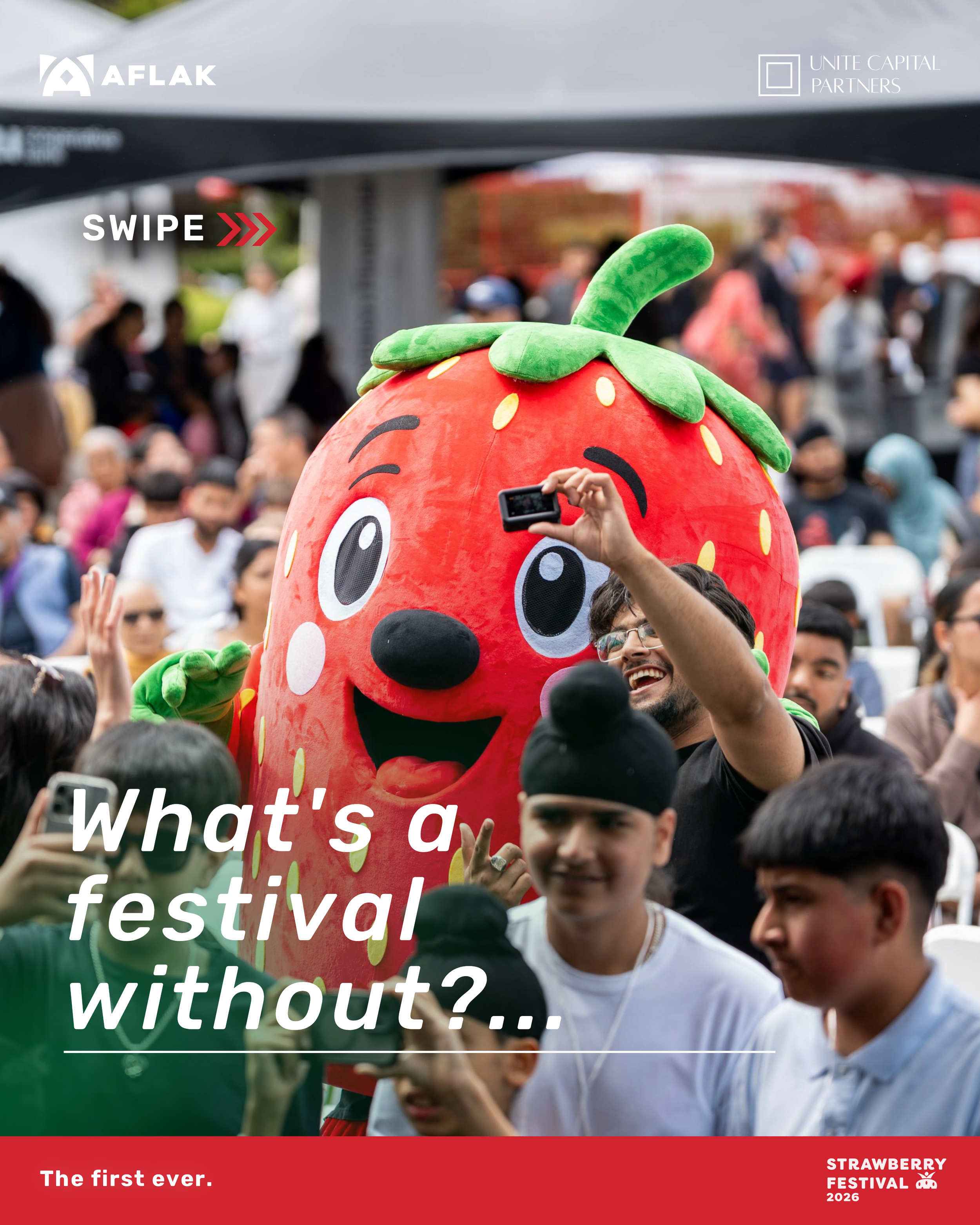 Crowd at the Strawberry Festival 2026, featuring a person in a strawberry costume, with on-screen text asking about the festival and mentioning it as the first of its kind.